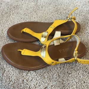 Lightly worn yellow Michael Kors sandals. Size 6.5.